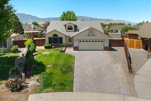 1290 Saddlehorn Ct, Minden, NV 89423 - view of front of house with a garage, a mountain view, and decorative driveway