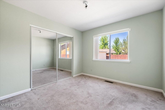 1290 Saddlehorn Ct, Minden, NV 89423 - unfurnished bedroom with carpet, multiple windows, and a closet
