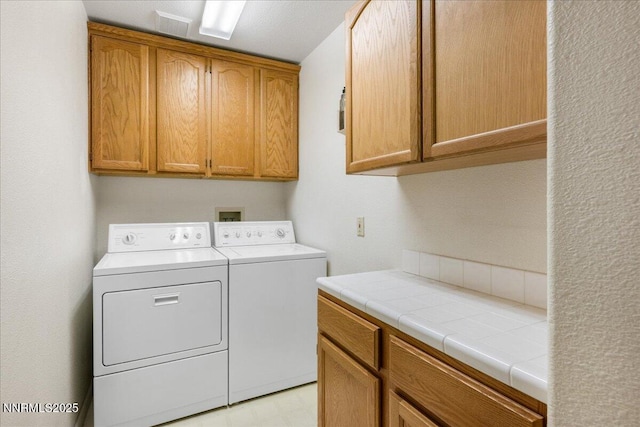 1290 Saddlehorn Ct, Minden, NV 89423 - washroom with cabinet space and washer and clothes dryer