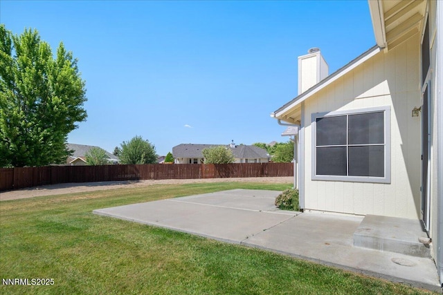 1290 Saddlehorn Ct, Minden, NV 89423 - fenced backyard with a patio area