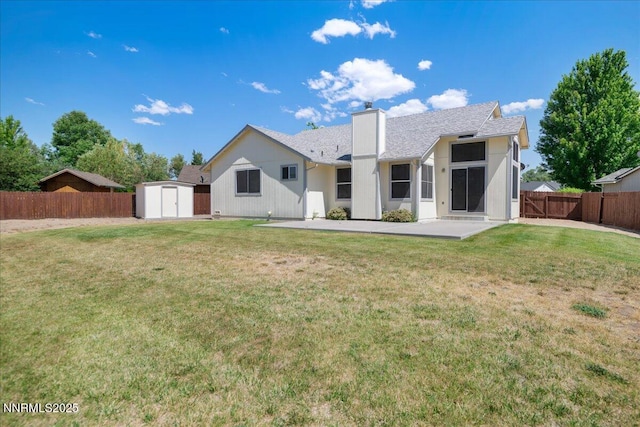 1290 Saddlehorn Ct, Minden, NV 89423 - rear view of house with a shed, a chimney, a fenced backyard, a patio, and roof with shingles