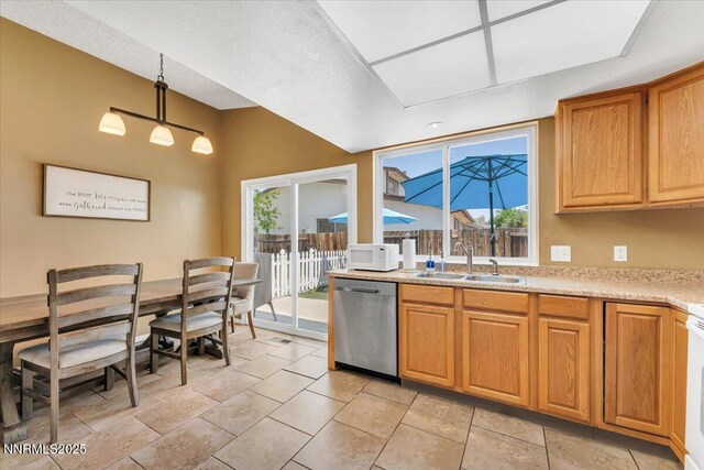 809 Glen Valley Dr, Sparks, NV 89434 - kitchen with dishwasher, a sink, white microwave, light countertops, and pendant lighting