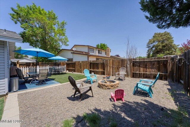 809 Glen Valley Dr, Sparks, NV 89434 - fenced backyard with a fire pit and a patio