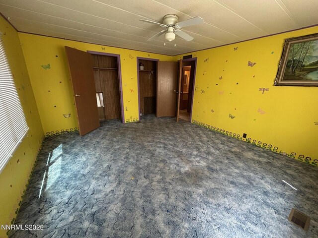 6480 Teal Dr, Fallon, NV 89406 - unfurnished bedroom with two closets and carpet flooring