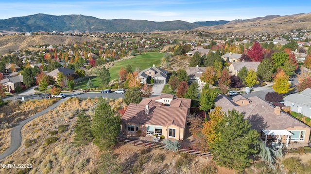 7601 Autumn Ridge Cir, Reno, NV 89523 - aerial overview of property's location with nearby suburban area and a mountainous background