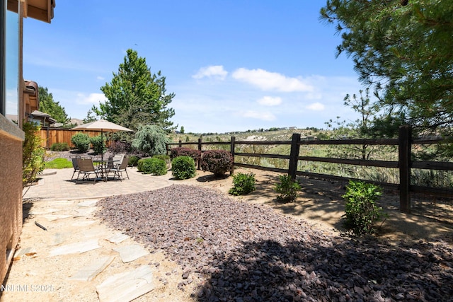 7601 Autumn Ridge Cir, Reno, NV 89523 - fenced backyard with a patio