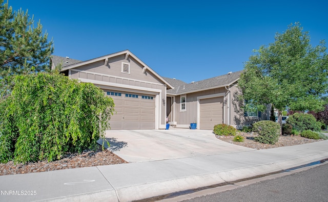 1221 Lasso Ln, Gardnerville, NV 89410 - single story home featuring a garage, concrete driveway, and board and batten siding