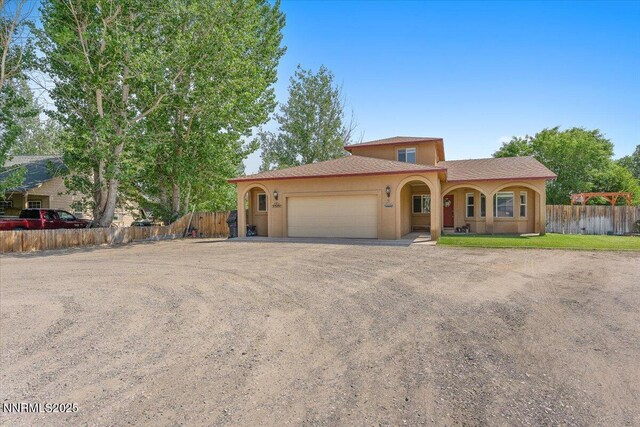 805 Samantha Cir, Fallon, NV 89406 - mediterranean / spanish house featuring an attached garage, stucco siding, and driveway