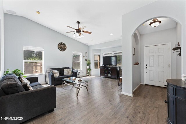 805 Samantha Cir, Fallon, NV 89406 - living room with arched walkways, lofted ceiling, a ceiling fan, wood finished floors, and baseboards