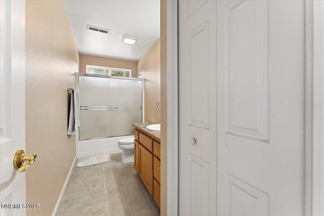 805 Samantha Cir, Fallon, NV 89406 - bathroom featuring toilet, vanity, shower / bath combination with glass door, and baseboards
