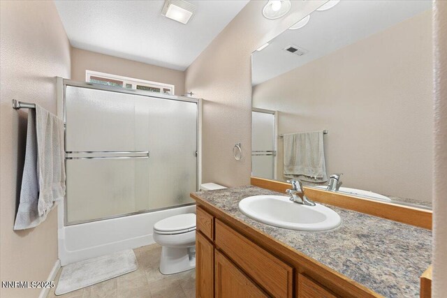 805 Samantha Cir, Fallon, NV 89406 - bathroom featuring toilet, vanity, and combined bath / shower with glass door
