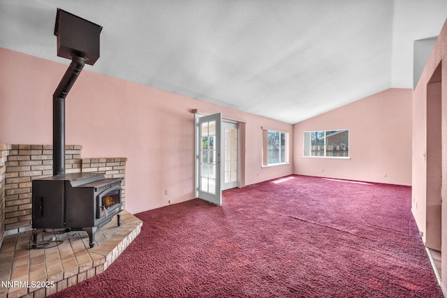 1331 Victoria Dr, Gardnerville, NV 89460 - carpeted living room with a wood stove and lofted ceiling