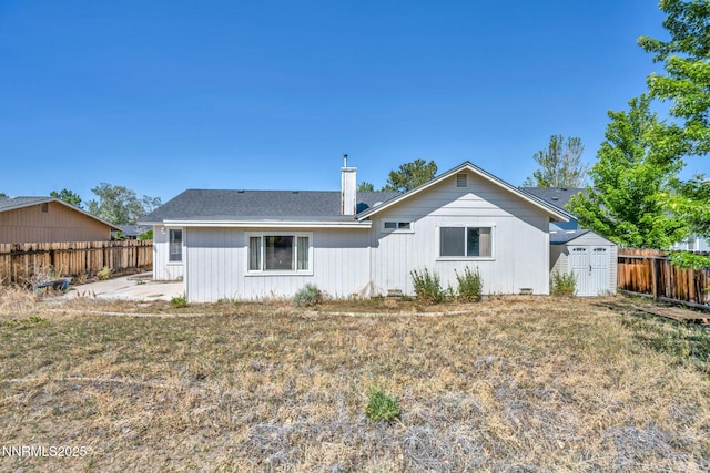 1331 Victoria Dr, Gardnerville, NV 89460 - rear view of house with a fenced backyard, a chimney, and a patio
