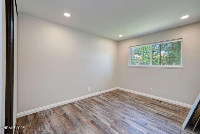 715 Emerson Way, Sparks, NV 89431 - unfurnished room featuring baseboards, wood finished floors, and recessed lighting