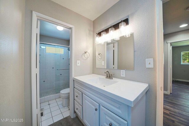 715 Emerson Way, Sparks, NV 89431 - full bath with toilet, a shower stall, vanity, tile patterned flooring, and baseboards