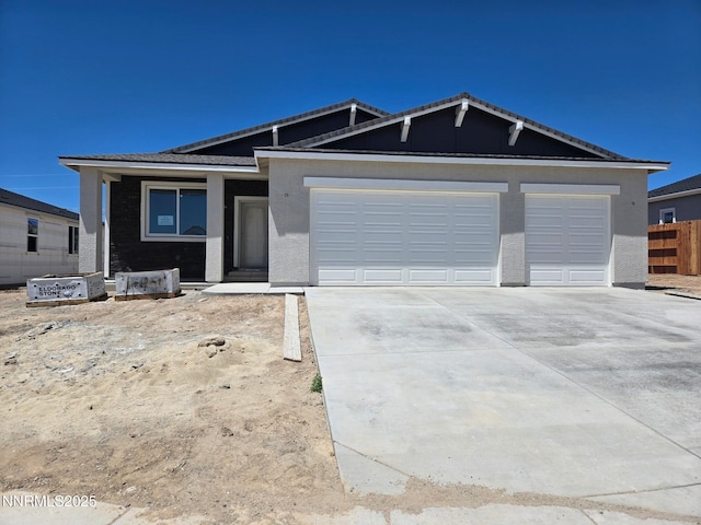 4059 Cone Peak Ct, Reno, NV 89508 - ranch-style house featuring driveway, an attached garage, and stucco siding