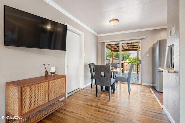 2441 Riviera St, Reno, NV 89509 - dining area featuring ornamental molding, light wood-style flooring, and baseboards