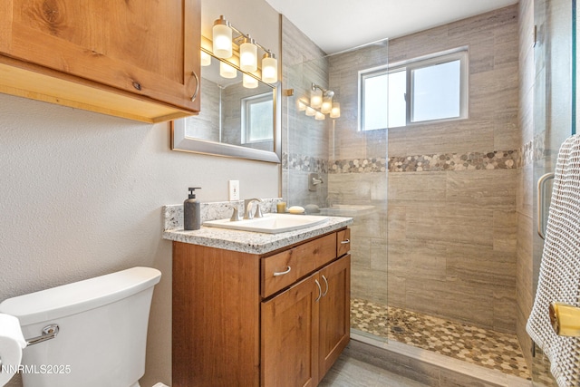 2441 Riviera St, Reno, NV 89509 - full bathroom featuring vanity, toilet, and tiled shower