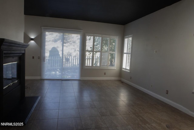 1570 Caughlin Creek Rd, Reno, NV 89519 - spare room featuring baseboards and tile patterned flooring