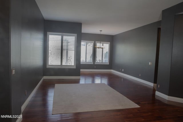 1570 Caughlin Creek Rd, Reno, NV 89519 - unfurnished room with a chandelier and wood finished floors