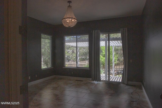 1570 Caughlin Creek Rd, Reno, NV 89519 - spare room with a chandelier and baseboards