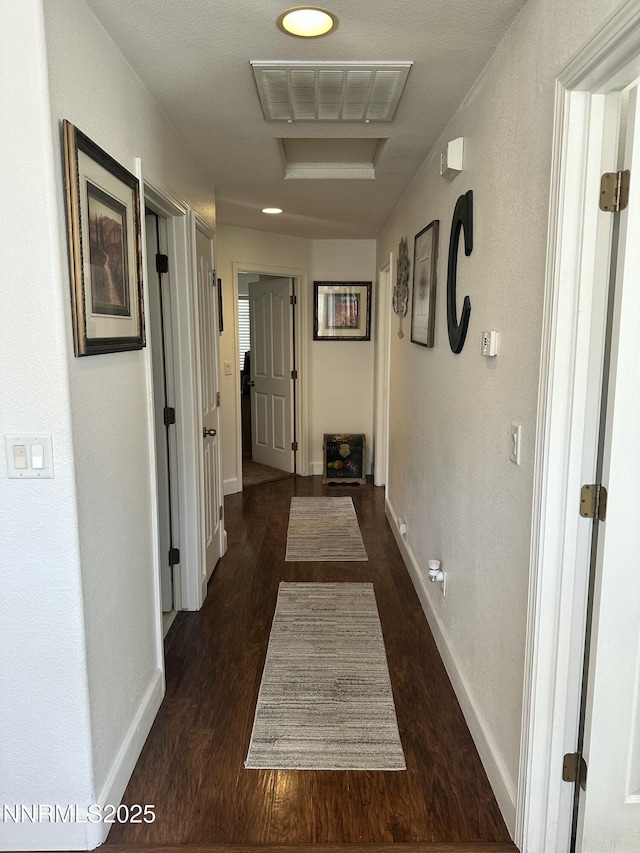 2787 Foxhill Dr, Carson City, NV 89706 - corridor featuring dark wood finished floors and baseboards