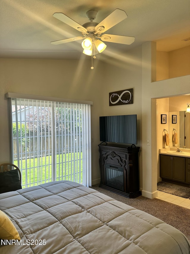 2787 Foxhill Dr, Carson City, NV 89706 - bedroom featuring a sink, ensuite bathroom, light carpet, baseboards, and high vaulted ceiling
