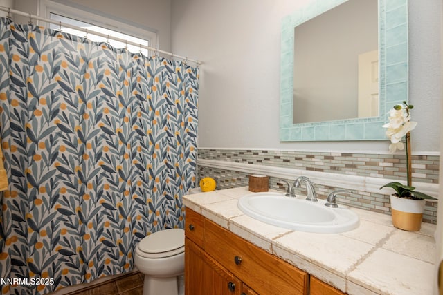 1781 Glen Cove Ct, Reno, NV 89521 - full bathroom featuring vanity, toilet, tasteful backsplash, and curtained shower