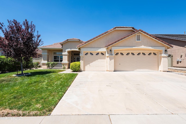 1781 Glen Cove Ct, Reno, NV 89521 - view of front facade with a garage, stucco siding, driveway, a front yard, and a tiled roof