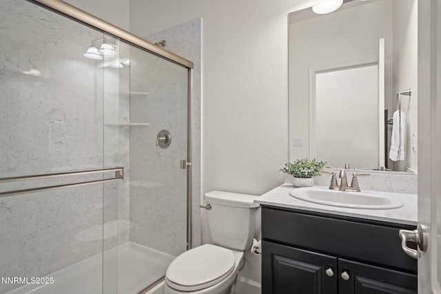 10450 Palladium Mine Dr, Reno, NV 89521 - bathroom with vanity, toilet, a shower stall, and a textured wall