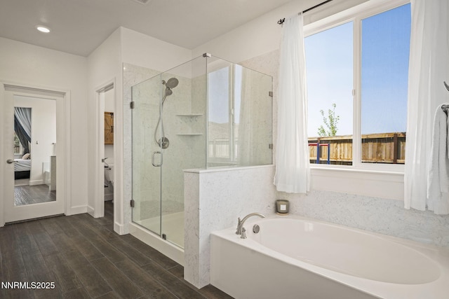 10450 Palladium Mine Dr, Reno, NV 89521 - ensuite bathroom with a garden tub, a shower stall, wood finished floors, and recessed lighting