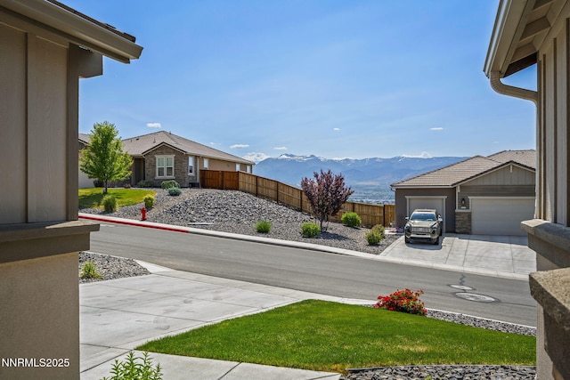 10450 Palladium Mine Dr, Reno, NV 89521 - view of yard with a mountain view, concrete driveway, and an attached garage