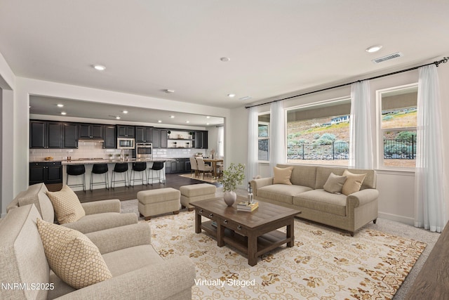 10450 Palladium Mine Dr, Reno, NV 89521 - living room with recessed lighting, baseboards, and light wood finished floors