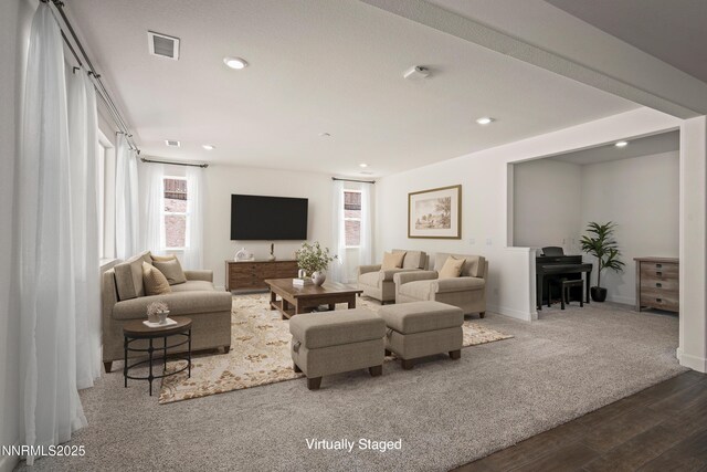 10450 Palladium Mine Dr, Reno, NV 89521 - living area with healthy amount of natural light, wood finished floors, recessed lighting, and baseboards
