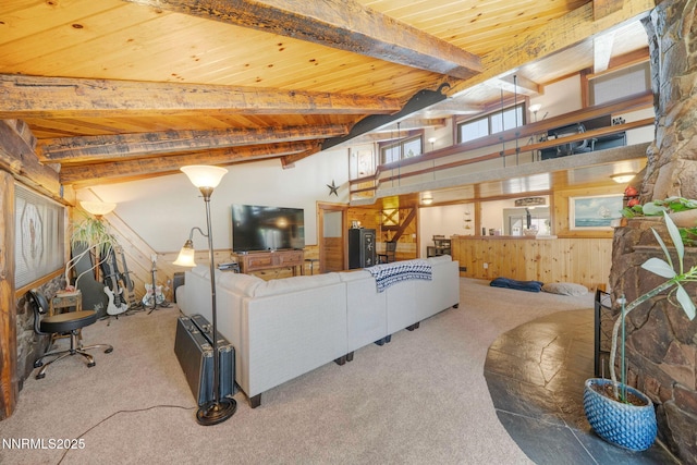 12245 Spruce Ln, Reno, NV 89511 - carpeted living room featuring wooden ceiling with exposed beams, high vaulted ceiling, and wood walls