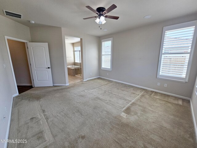 217 Bristol Wells Ct, Spanish Springs, NV 89441 - unfurnished bedroom with carpet floors, baseboards, connected bathroom, and ceiling fan