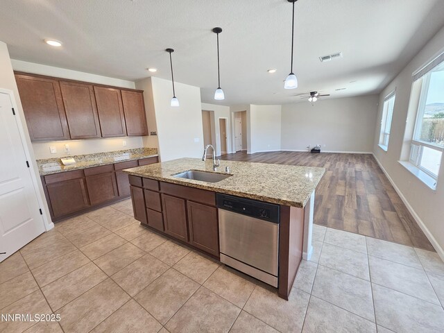 217 Bristol Wells Ct, Spanish Springs, NV 89441 - kitchen featuring a sink, stainless steel dishwasher, recessed lighting, a kitchen island with sink, and pendant lighting