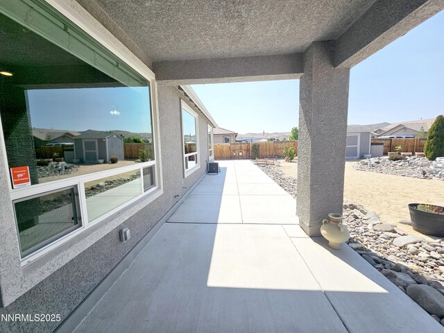 217 Bristol Wells Ct, Spanish Springs, NV 89441 - fenced backyard with a patio area