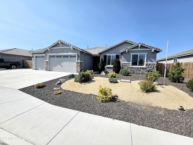 217 Bristol Wells Ct, Spanish Springs, NV 89441 - view of front of house with stone siding, an attached garage, and stucco siding
