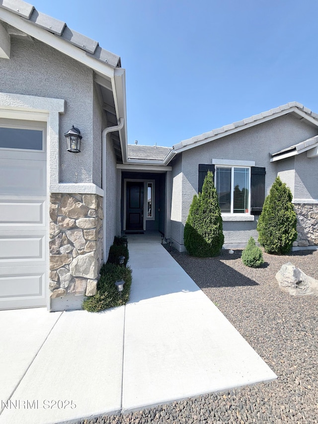 217 Bristol Wells Ct, Spanish Springs, NV 89441 - doorway to property with stucco siding and stone siding