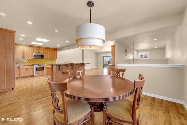 3467 Skyline Blvd, Reno, NV 89509 - dining room with recessed lighting, light wood finished floors, and baseboards