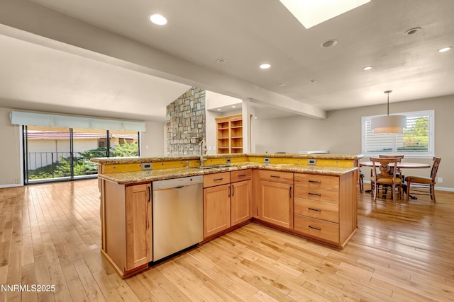 3467 Skyline Blvd, Reno, NV 89509 - kitchen featuring stainless steel dishwasher, a sink, light wood-style flooring, light stone counters, and vaulted ceiling
