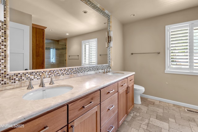 3467 Skyline Blvd, Reno, NV 89509 - full bathroom featuring double vanity, a shower stall, toilet, baseboards, and recessed lighting