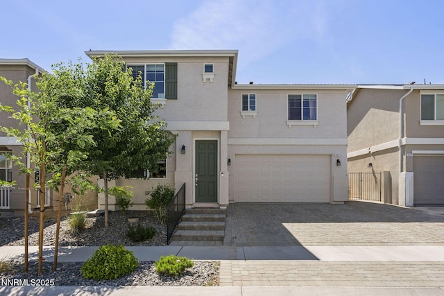 3621 Pimlico St, Reno, NV 89512 - view of front of property with stucco siding, a garage, and decorative driveway