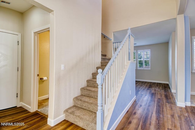 10595 Baton Ct, Reno, NV 89521 - staircase featuring wood finished floors and baseboards