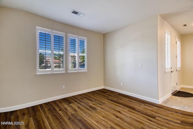 10595 Baton Ct, Reno, NV 89521 - unfurnished room with wood finished floors and baseboards