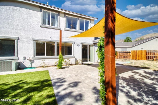10595 Baton Ct, Reno, NV 89521 - back of property with stucco siding, a patio, and central AC unit