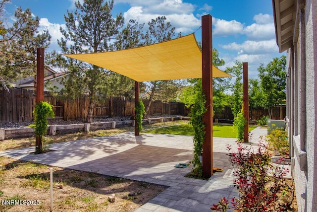 10595 Baton Ct, Reno, NV 89521 - fenced backyard featuring a patio