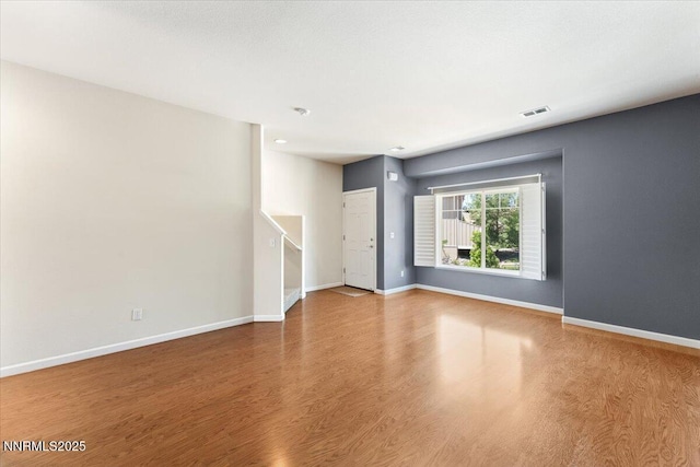 4136 Kathleen Denise Ln, Reno, NV 89503 - unfurnished room featuring stairs, wood finished floors, and baseboards