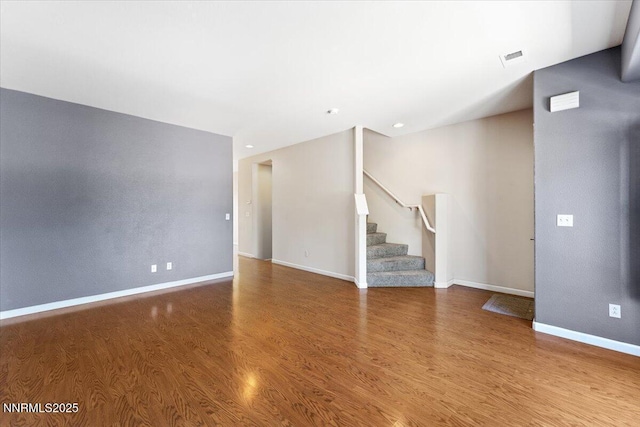 4136 Kathleen Denise Ln, Reno, NV 89503 - unfurnished living room with wood finished floors, stairway, and baseboards